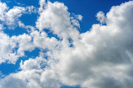 Blue sky with clouds of different shapes. Cloudy overcast sky.の写真素材