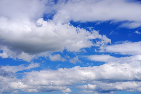 Blue sky with clouds of different shapes. Cloudy overcast sky.の写真素材