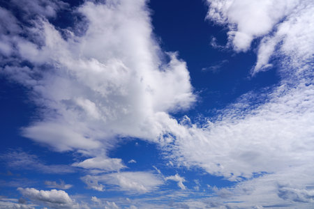 Blue sky with clouds of different shapes. Cloudy overcast sky.の写真素材