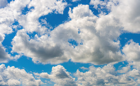 Blue sky with clouds of different shapes. Cloudy overcast sky.の写真素材