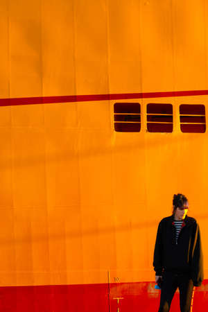 Alternative girl in yellow background sad with a bubblegumの写真素材