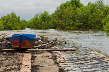 wooden boat on the beach with a beautiful skyの写真素材