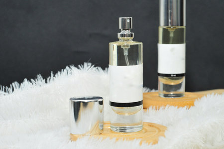 <p>a perfume bottle spray&nbsp;on white carpet</p>の写真素材
