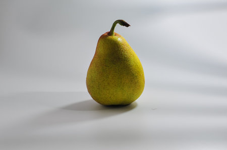 pear on a white background with shadow and copyspace.の写真素材