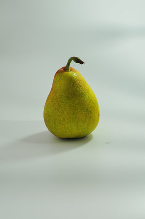 pear on a white background with shadow and copyspace.の写真素材