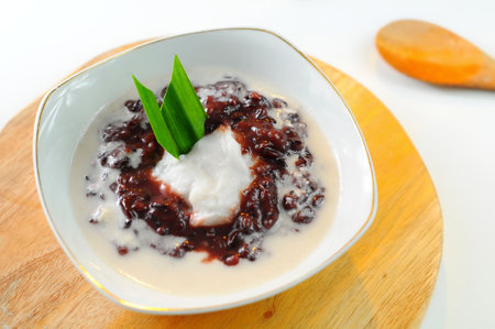 Thai dessert, Black sticky rice with coconut milk in coconut milkの写真素材