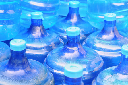 plastic bottles of water on the market, closeup of photoの写真素材