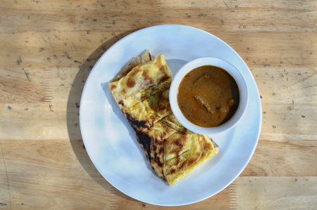 Thai food,Thai pancake with curry on wooden tableの写真素材