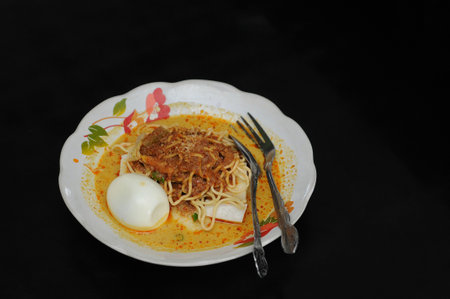 Lontong is a food made from rice wrapped in banana leaves and then boiled. This food is often considered another form of rice and can be paired with various side dishesの写真素材