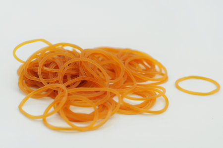 Rubber bands of different colors on a white background close-up
