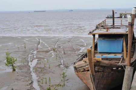 Fishing boat on the beach at low tide,Thailand.