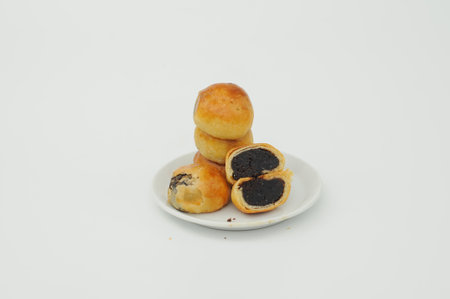 Bakpia is a popular Indonesian and Philippine bean-filled moon cake-like pastry originally introduced by Fujianese immigrants in the urban centers of both nations around the pastの写真素材