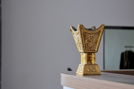 golden object on the shelf in the room.の写真素材