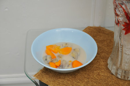 Mushroom porridge with pumpkin and carrot in a blue bowlの写真素材