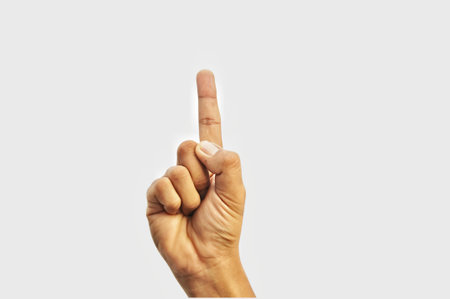 Human hand showing middle finger isolated on white background with clipping path.の写真素材