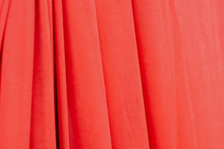 Red fabric as a background, close-up. Red fabric textureの写真素材