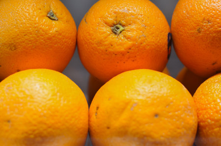 Oranges in a market stall, close-up, selective focusの写真素材