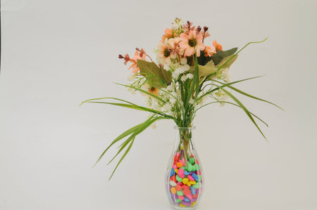 Bouquet of flowers in glass vase on white background.の写真素材