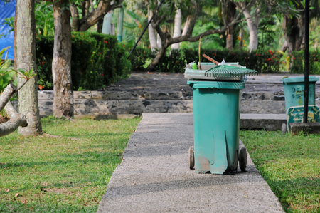Trash can in the park with green nature background, stock photoの写真素材