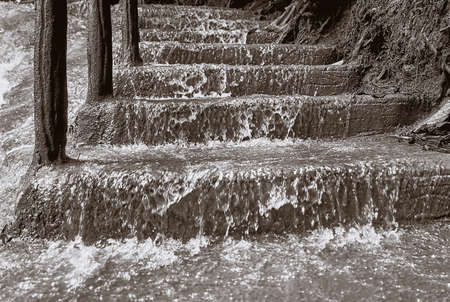 Water runs through the stairsの写真素材