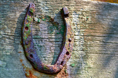 old rusty horseshoe on the wallの写真素材