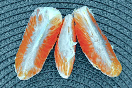 Peeled slices of citrus fruitの写真素材
