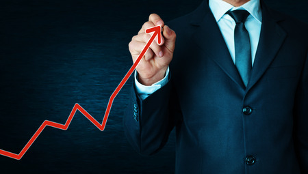 Businessman drawing arrow. Growth concept.の写真素材