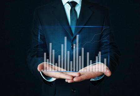Businessman holding graph. Finance concept.の写真素材