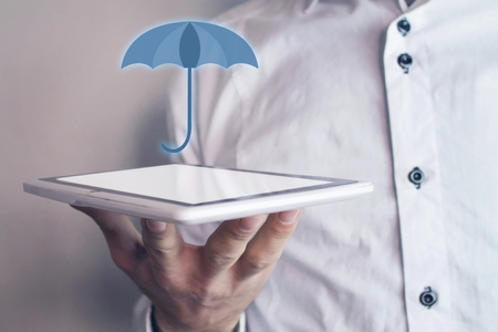 Man holding umbrella. Protection concept.の写真素材
