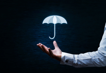 Man holding umbrella. Protection concept.の写真素材