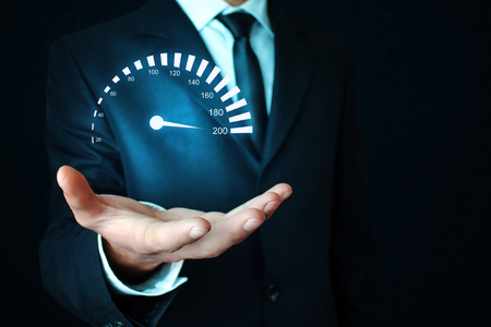 Man holding car speedometer. Speed concept.の写真素材