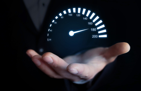Man holding car speedometer. Speed concept.の写真素材