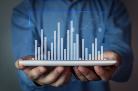 Businessman holding graph. Finance concept.の写真素材