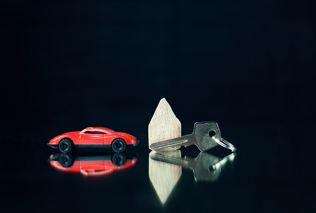 House key and car on a black background.の写真素材