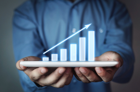 Businessman holding business graph.の写真素材