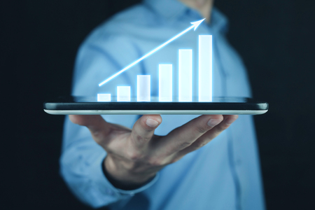 Businessman holding business graph.の写真素材