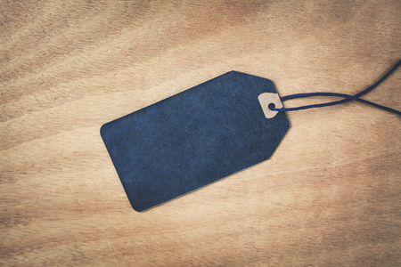 Blank sale label on a wood background.の写真素材