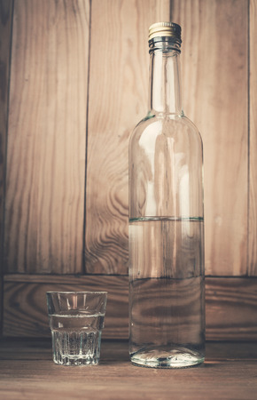 Vodka on a wood background.の写真素材