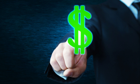 Businessman hand touching on a dollar sign.の写真素材