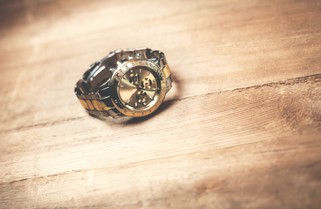 Wristwatch on a wood background.の写真素材