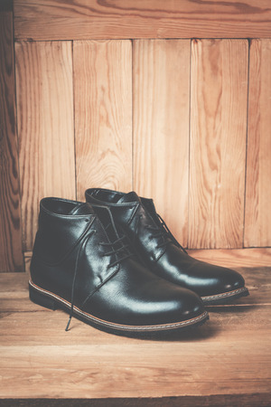 Menâs footwear on the wooden background.の写真素材