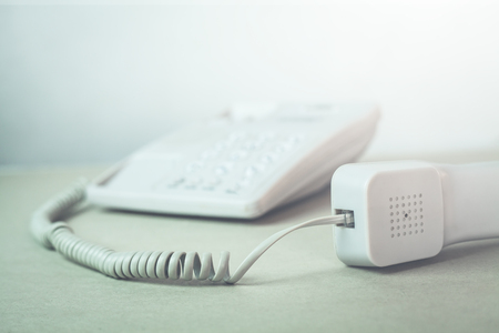 Office phone on a desk.の写真素材