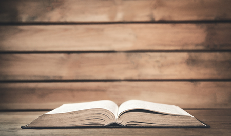 Bible on a wood background.の写真素材