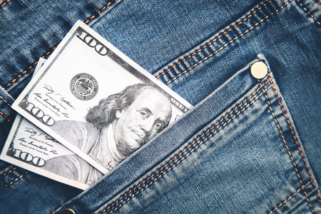 Hundred dollars in the pocket of jeans.の写真素材