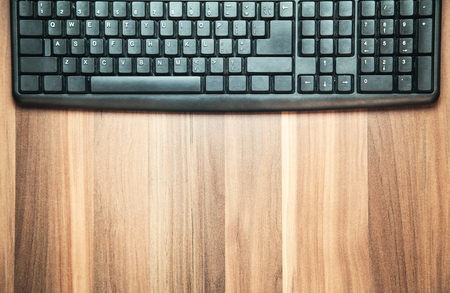 Computer keyboard on the wood background.の写真素材