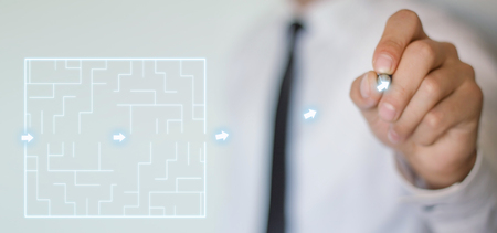 Man finding the solution of a labyrinth.の写真素材