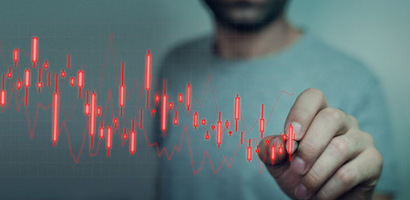 Man drawing on stock falling graph.の写真素材