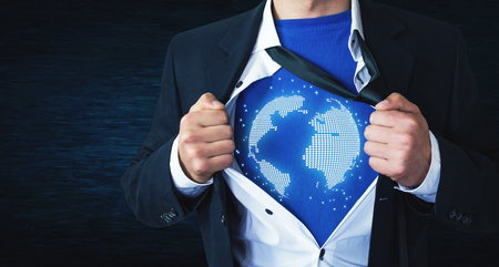 Businessman tearing his shirt and showing globe. Global businessmanの写真素材