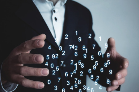 Man holding numbers. Digital information conceptの写真素材