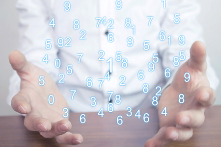Man holding numbers. Digital information conceptの写真素材